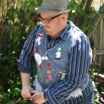 Picture of a man digging in the garden in an ugly Christmas sweater vest