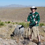 Wearing an ugly Christmas sweater in front of the Christmas Mountains of Texas