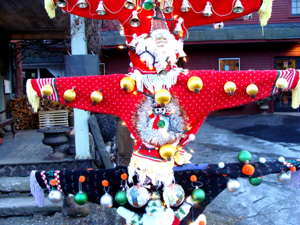 Ugly Christmas sweater totem pole at Fossil Glass, Woodstock, Vermont