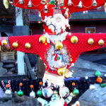 Ugly Christmas sweater totem pole at Fossil Glass, Woodstock, Vermont