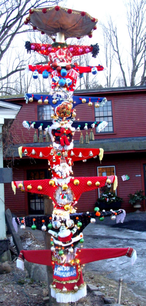 Ugly Christmas sweater totem pole at Fossil Glass, Woodstock, Vermont